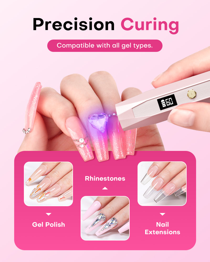 Hand holding a Gugusure pink wand nail light to precision cure rhinestones on a long pink gel nail extension.