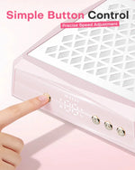 Close-up of a finger pressing the gold simple control buttons on the pink aluminum nail desk vacuum. Allows for precise speed adjustment with a sleek, blank digital display.