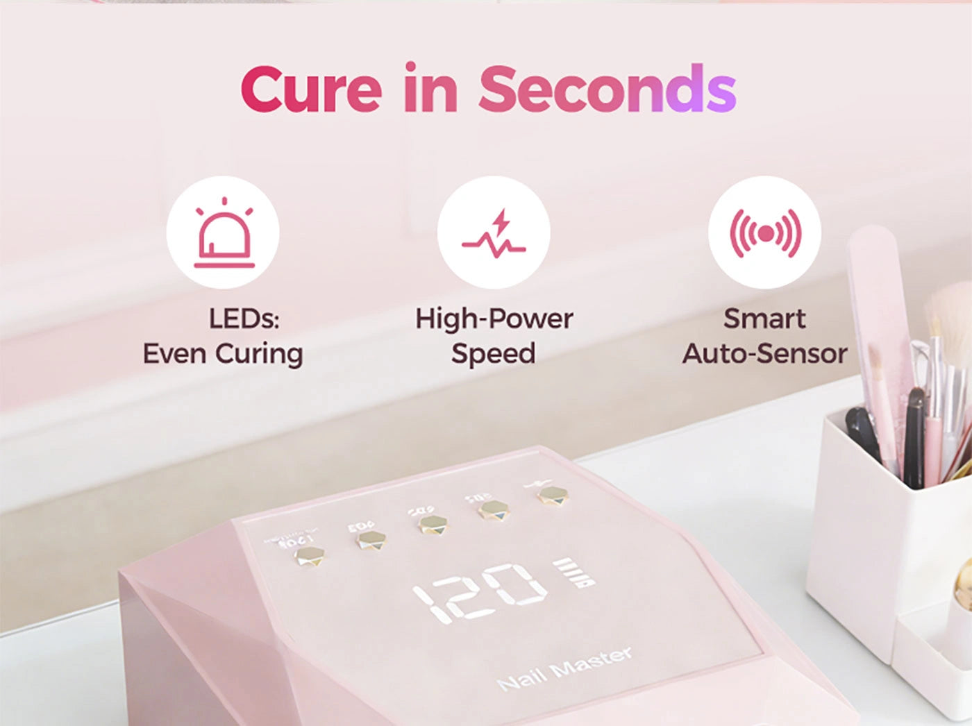 Showcasing the fast-drying features of the pink aluminum UV LED nail lamp. Designed with even-curing LEDs, high-power speed, and a smart auto-sensor. The geometric metal body features gold buttons and a blank screen.