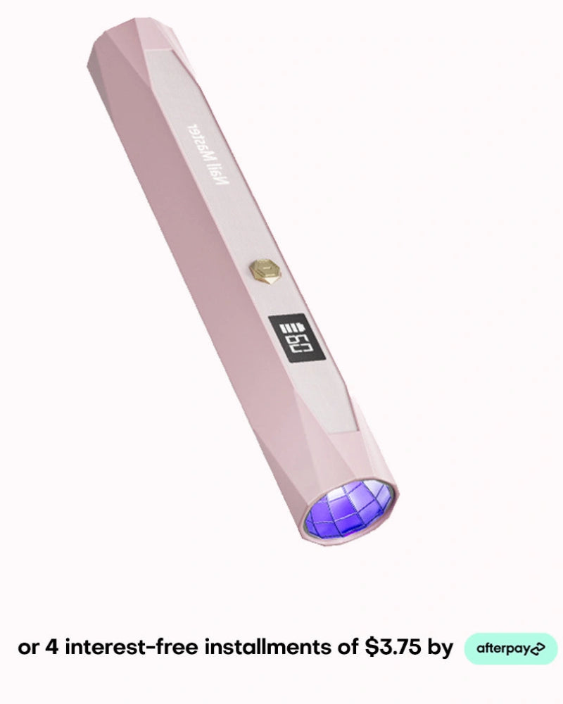 Achieve flawless gel extensions anywhere with this pink portable flash cure gel nail light. This convenient handheld UV LED curing pen showcases a stylish geometric body, a single operational gold button, and a sleek blank digital display for an effortless DIY home salon experience. Add this compact nail dryer to your collection and take advantage of convenient checkout with four easy interest-free installments of $3.75 using Afterpay.